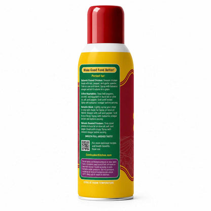 A yellow and red canister of Cornhusker Kitchen seasoning spray shown from the back, displaying detailed product instructions on a white background.
