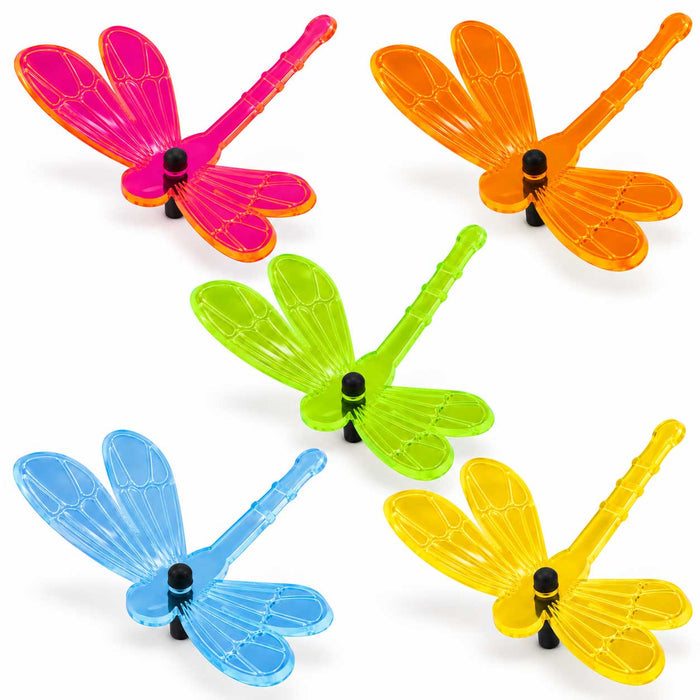 Five translucent dragonfly-shaped items in bright pink, orange, green, blue, and yellow, arranged on a clean white background.