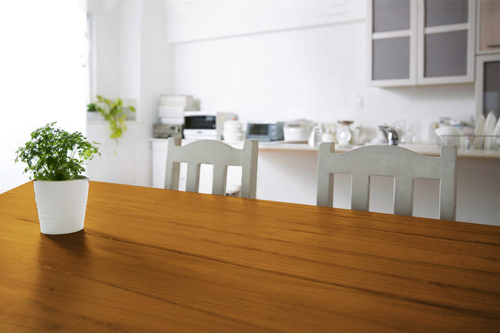 Retique It Wood'n Finish Kit with four large cedar stains, showing textured wood grain on a tabletop surface.