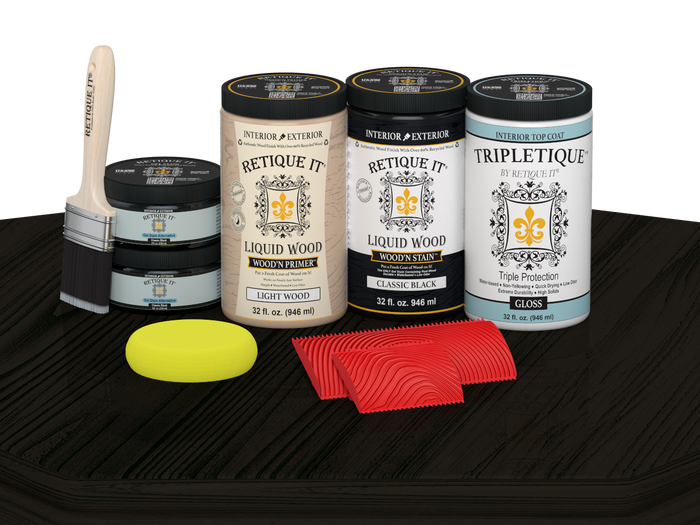 Retique It Wood'n Finish Kit with four large black stain bottles and a glossy finish on a wood tabletop surface.