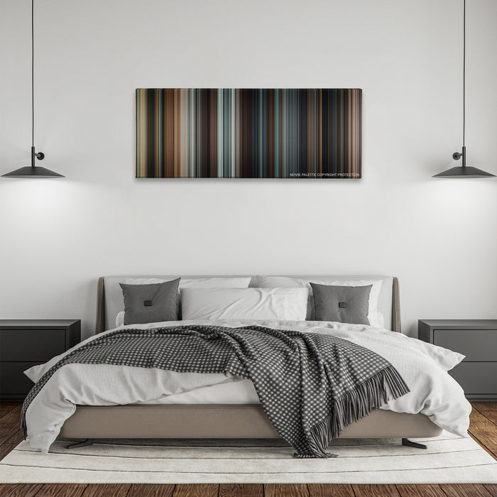 Taken color palette canvas above a bed, between two black pendant lamps