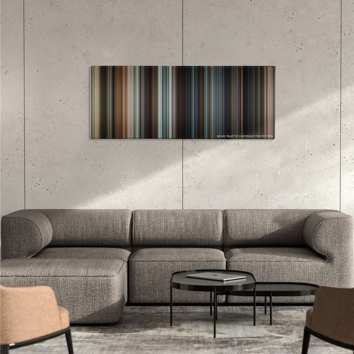 Taken color palette canvas on a concrete wall above a gray sectional sofa