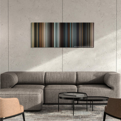 Taken color palette canvas on a concrete wall above a gray sectional sofa