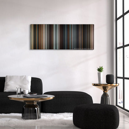 Taken color palette canvas above a black sofa with a gold-topped table