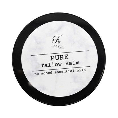 Pure tallow balm container with black lid on a white background