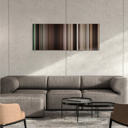 The Book of Eli color palette canvas on a concrete wall above a gray sectional sofa