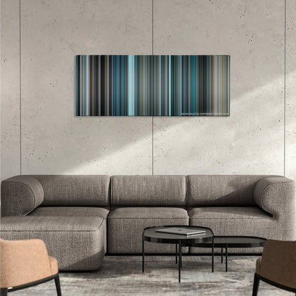 The Bourne Legacy color palette canvas on a concrete wall above a gray sectional sofa