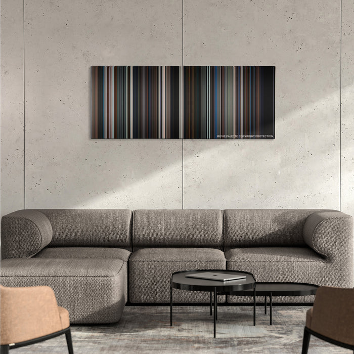 The Dark Knight color palette canvas on a concrete wall above a gray sectional sofa